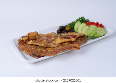 Shot From Opposite Or Side Angle In Isolated Environment With Selective Focus On Gray Background; Image Of Sliced Cucumber And Tomato Slices, Olives And Veggie Omelet.