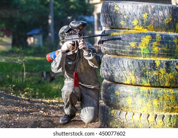 Shot from paintball gun. Flying ball with smoke trace behind.