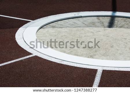 Shot Put and hammer ring. Athletic stadium. Beautiful sunny weather.
