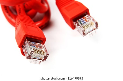 A shot of red UTP network cables. White background. Studio shot. Data Network Hardware Concept. RJ45 connectors. - Powered by Shutterstock - Get 15% off with code: PIKWIZARD15