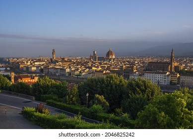 A shot of the Santa Maria del Fiore cathedral and Vecchio's tower during sunset in Florence, Tuscany, Italy