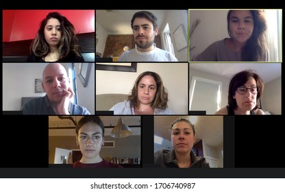 Shot of a screen of teammates doing a virtual conference from their home offices.  Team meeting from home during COVID-19 coronavirus pandemic.