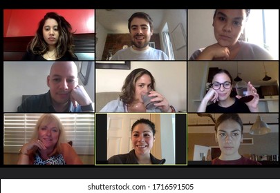 Shot of a screen of teammates doing a virtual happy hour from their home offices.  Team meeting from home during COVID-19 coronavirus pandemic. - Shutterstock ID 1716591505