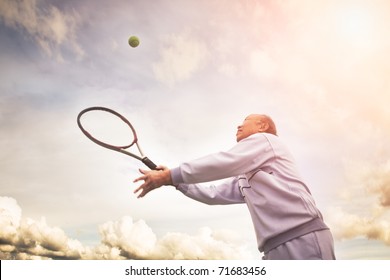 A shot of a senior asian man playing tennis - Powered by Shutterstock