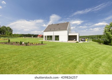 Shot Of A Small Detached House With A Big Garden