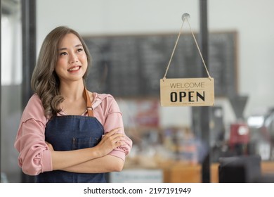 Shot Of Smiling Asian Young Sme Small Business Owner Wearing Apron And Standing White Ipad And Open Sign Coffee Shop Door, Asian Business Woman Barista Cafe Owner SME Entrepreneur Seller Concept