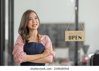 Shot Of Smiling Asian Young Sme Small Business Owner Wearing Apron And Standing White Ipad And Open Sign Coffee Shop Door, Asian Business Woman Barista Cafe Owner SME Entrepreneur Seller Concept