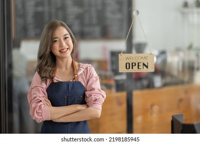 Shot Of Smiling Asian Young Sme Small Business Owner Wearing Apron And Standing White Ipad And Open Sign Coffee Shop Door, Asian Business Woman Barista Cafe Owner SME Entrepreneur Seller Concept