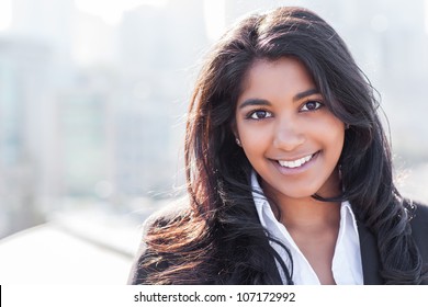 A shot of a smiling confident Asian Indian businesswoman outdoor