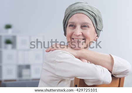 Shot of a smiling woman after a chemotherapy