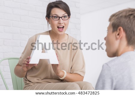 Shot of a speech therapist during a session with a little boy