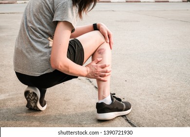 Shot of sport woman suffering from injury, she had bruise on her leg. Injured after runner falling or impact floor. Bruises happen when small blood vessels in the skin are damaged.