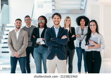 Shot of successful business multiage team posing and looking at camera in modern startup. - Powered by Shutterstock