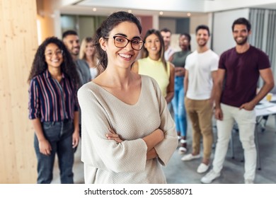 Shot of successful business team posing for presentation of work while looking at camera in a coworking space. - Shutterstock ID 2055858071