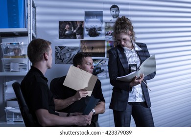 Shot Of Three Police Officers Trying To Solve A Case