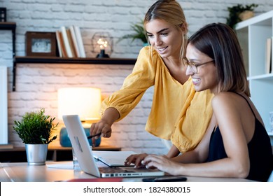 Shot Of Two Beautiful Freelance Business Women Seller Checking Product Order With Computer In Their Startup Small Business. 