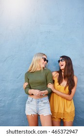 Shot Of Two Best Friends Wearing Stylish Outfits, Going Crazy And Having Great Time Together. Two Young Women Standing Together Laughing.