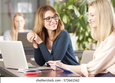 Shot Of Two Professional Women Working Together On A New Business Project.