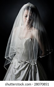 Shot of an Unhappy Bride against Dark Background