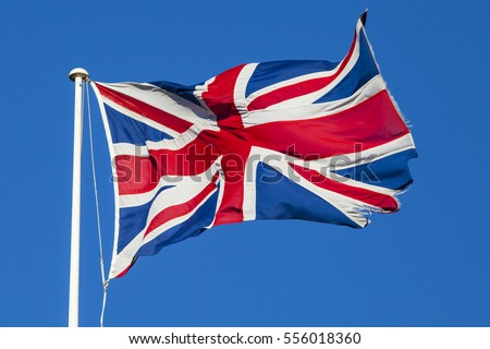 A shot of the Union Flag flying over a clear blue sky.