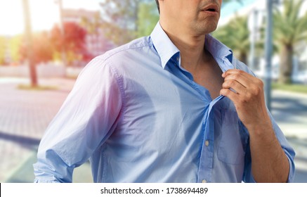 Shot of an unrecognizable man undressing because of the heat and sweat on a hot summer day - Shutterstock ID 1738694489