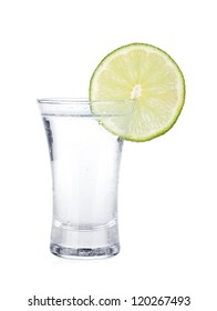 Shot Of Vodka And Lime Slice. Isolated On White Background