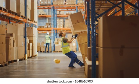 Shot Of A Warehouse Worker Has Work Related Accident. He Is Falling Down BeforeTrying To Pick Up Heavy Cardboard Box From The Shelf. Hard Injury At Work.