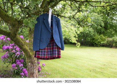 Shot Of A Wedding Kilt Hanging On Wooden Frame