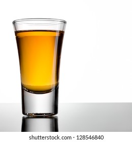 Shot Of Whiskey On A White Background