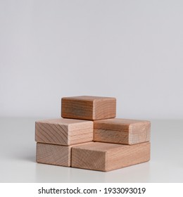 shot of wooden cube on the grey background