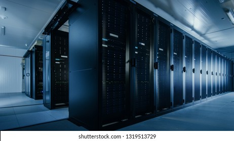 Shot of a Working Data Center With Rows of Rack Servers. Led Lights Blinking and Computers are Working.