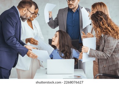 Shot of a young businesswoman looking anxious in a demanding office environment. Frustrated millennial female worker felling tired of working quarreling. Workplace Conflicts.  - Powered by Shutterstock