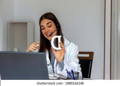 Shot Of A Young Female Speech Teacher Hold Speech Therapy Session With Students Online, Teaches Pronunciation And Language Difficulties, Using Laptop. Speech Therapist Conducts An Online Lesson.