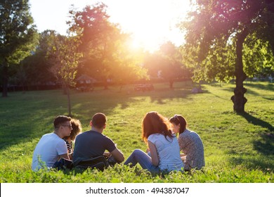 Shot of a young group of friends enjoying a day outdoors in a park - Shutterstock ID 494387047
