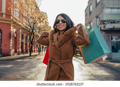 Shot of a young hispanic woman out shopping in the city