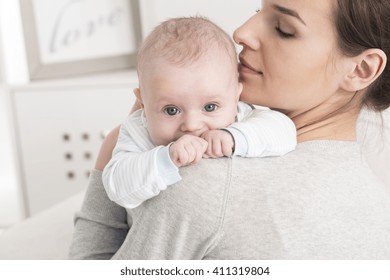 Shot Of A Young Mum Holding Her Baby