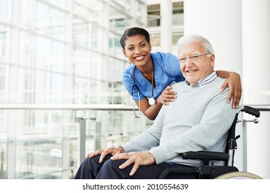 Shot Of A Young Nurse Caring For An Elderly Patient In A Wheelchair