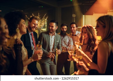 Shot Of Young People Partying In A Nightclub