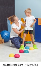 Shot Of A Young Physiotherapist Assisting Her Little Patient During A Sensory Integration Therapy