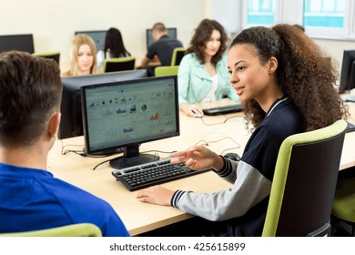 Shot of young IT students talking during the class - Shutterstock ID 425615899