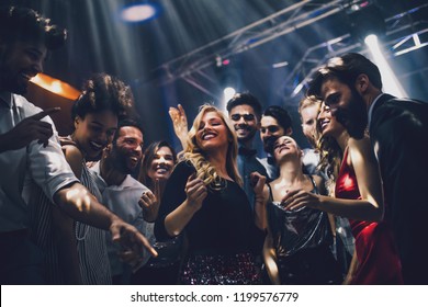 Shot of a young woman dancing in the nightclub - Powered by Shutterstock