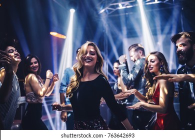 Shot of a young woman dancing in the nightclub