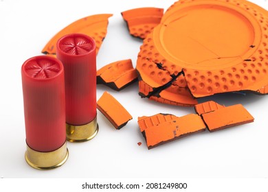 Shotgun Bullet And Broken Clay Target Shooting On White Background , Shooting Game 