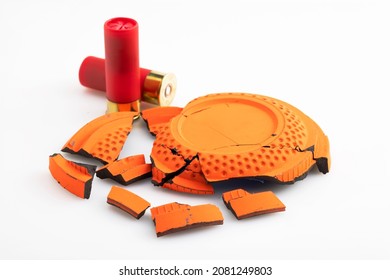 Shotgun Bullet And Broken Clay Target Shooting On White Background , Shooting Game 