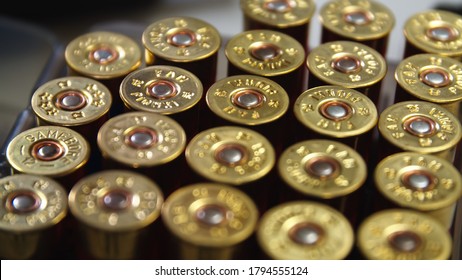 Shotgun cartridges Close-Up Shot of Shotgun Shells in Ammo Box.