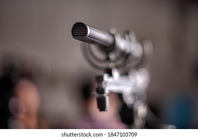 Shotgun Microphone. Condenser Hypercardioid Mic Mounted On Stand With Cable Attached. Macro Shot .