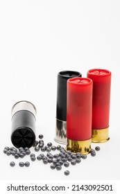 Shotgun Shell Ammunition And Lead Pellets On White Background , Gun And Shooting Game