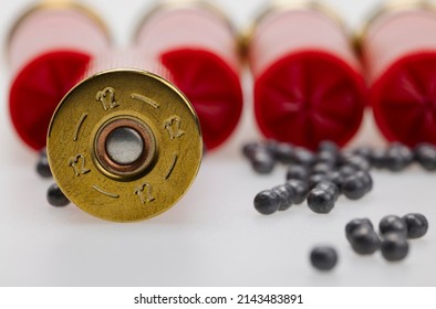 Shotgun Shell Ammunition And Lead Pellets On White Background , Gun And Shooting Game