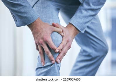 I Should Make More Time To Take Care Of My Health. Cropped Shot Of A Businessman Holding His Knee In Pain.