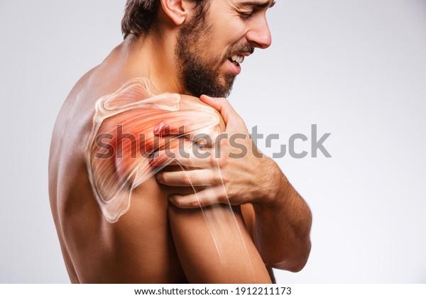 Shoulder muscle and nerve pain, man\
holding painful zone injured point, human body\
anatomy